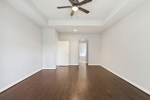 2203 Centerbrook Ln, Katy, TX 77450 - empty room with arched walkways, ceiling fan, recessed lighting, wood-type flooring, and baseboards
