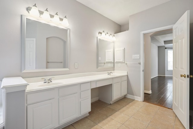 2203 Centerbrook Ln, Katy, TX 77450 - full bath featuring double vanity, baseboards, and tile patterned flooring