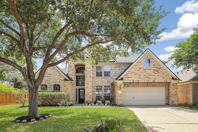 2203 Centerbrook Ln, Katy, TX 77450 - traditional-style house featuring concrete driveway, brick siding, and an attached garage