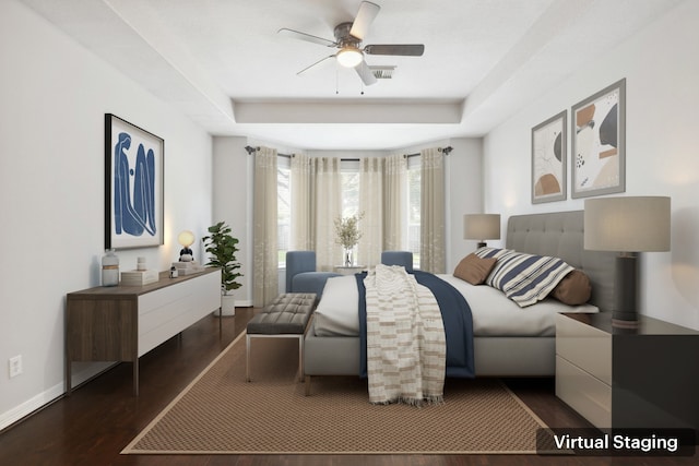 2203 Centerbrook Ln, Katy, TX 77450 - bedroom featuring a tray ceiling, dark wood-style flooring, baseboards, and a ceiling fan
