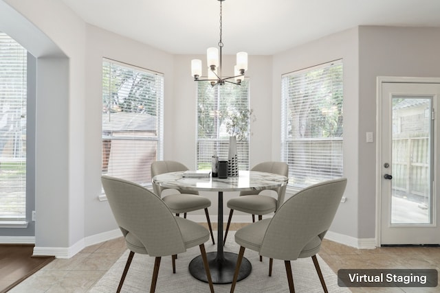 2203 Centerbrook Ln, Katy, TX 77450 - dining room with a chandelier and baseboards