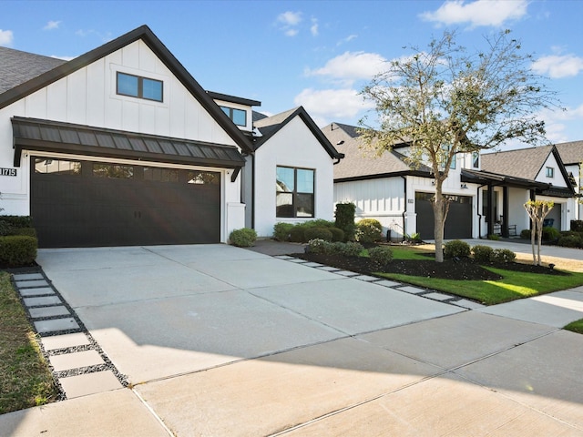 11715 Tranquility Summit Dr, Cypress, TX 77433 - modern farmhouse style home featuring concrete driveway, a garage, board and batten siding, a standing seam roof, and a shingled roof