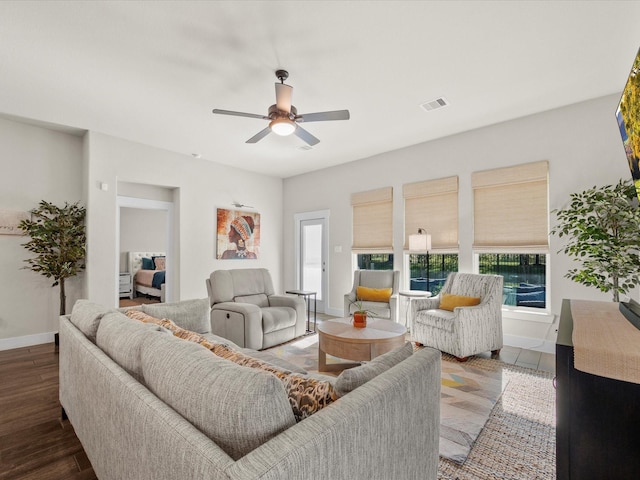 11715 Tranquility Summit Dr, Cypress, TX 77433 - living room with ceiling fan, baseboards, and wood finished floors