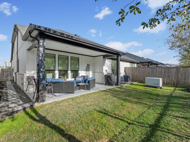 11715 Tranquility Summit Dr, Cypress, TX 77433 - back of house with an outdoor living space, a patio, and central AC