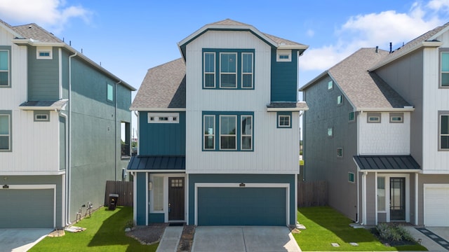 11909 Eastgrove Park Way, Houston, TX 77051 - view of front facade with roof with shingles, a garage, a standing seam roof, driveway, and metal roof