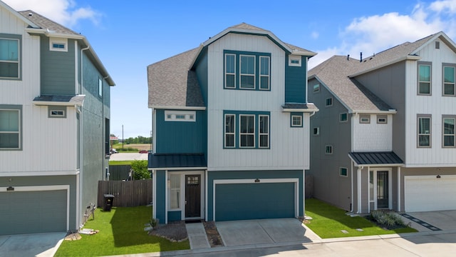 11909 Eastgrove Park Way, Houston, TX 77051 - view of front of house featuring a garage, a shingled roof, concrete driveway, and a standing seam roof