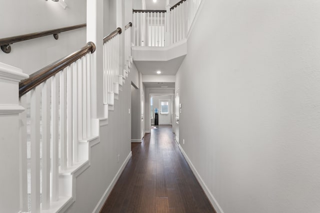 11909 Eastgrove Park Way, Houston, TX 77051 - hallway with baseboards, wood finished floors, stairway, and a towering ceiling