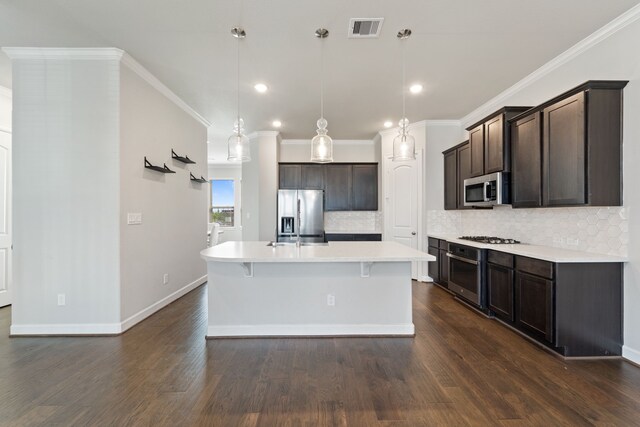 11909 Eastgrove Park Way, Houston, TX 77051 - kitchen with appliances with stainless steel finishes, backsplash, dark brown cabinetry, light countertops, and recessed lighting
