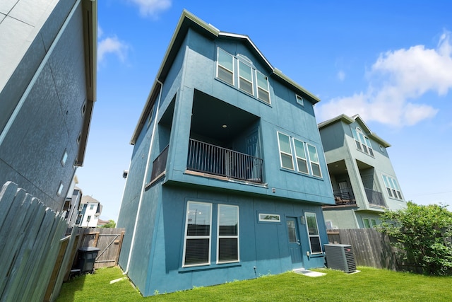 11909 Eastgrove Park Way, Houston, TX 77051 - back of house featuring stucco siding, cooling unit, and a balcony