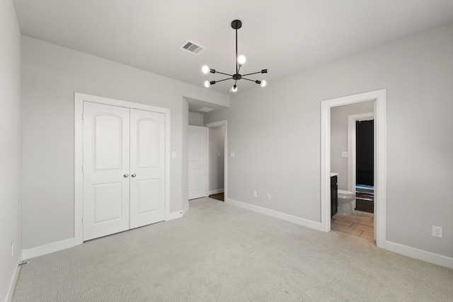 11909 Eastgrove Park Way, Houston, TX 77051 - unfurnished bedroom with carpet floors, a chandelier, baseboards, a closet, and connected bathroom