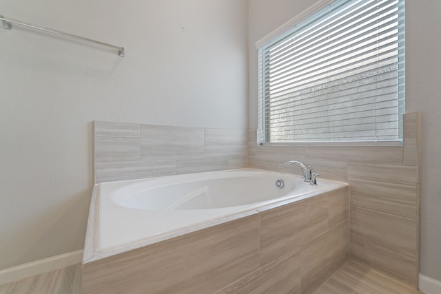 11909 Eastgrove Park Way, Houston, TX 77051 - bathroom with plenty of natural light and a bath