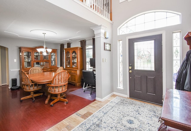 19711 Arbor Creek Dr, Katy, TX 77449 - entryway with wood finished floors, a chandelier, and baseboards