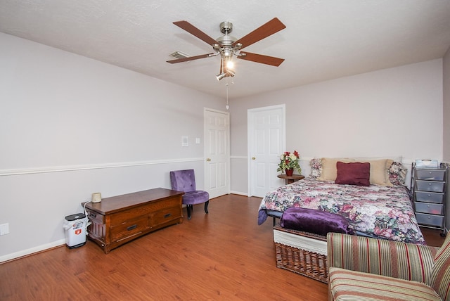 19711 Arbor Creek Dr, Katy, TX 77449 - bedroom with wood finished floors, baseboards, and a ceiling fan