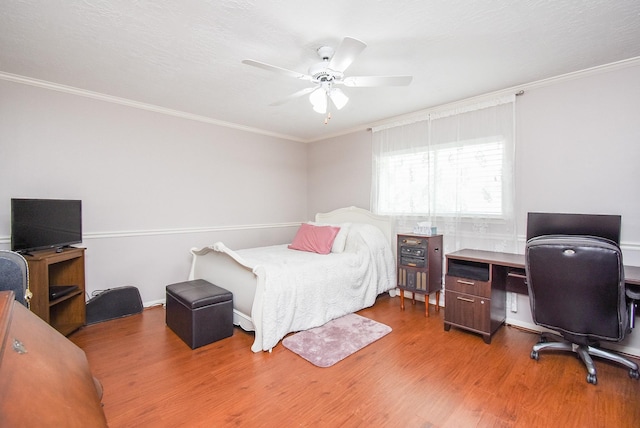 19711 Arbor Creek Dr, Katy, TX 77449 - bedroom with a desk, wood finished floors, ornamental molding, and a ceiling fan