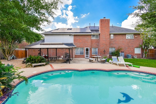 19711 Arbor Creek Dr, Katy, TX 77449 - view of pool with a gazebo, a patio area, a fenced backyard, and central air condition unit