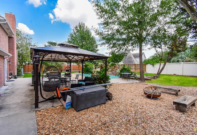 19711 Arbor Creek Dr, Katy, TX 77449 - fenced backyard featuring a patio, a gazebo, and an outdoor living space with a fire pit