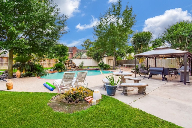 19711 Arbor Creek Dr, Katy, TX 77449 - view of pool with a shed, a gazebo, an outdoor structure, and a patio area