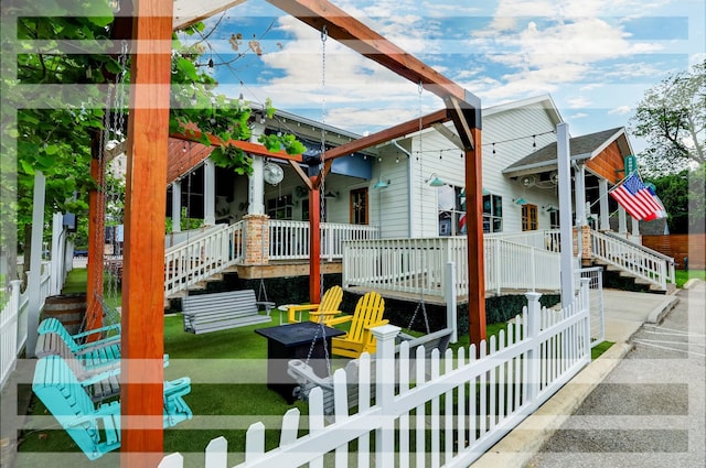 1244 W 18th St, Houston, TX 77008 - view of home's exterior featuring stairs, fence, and covered porch