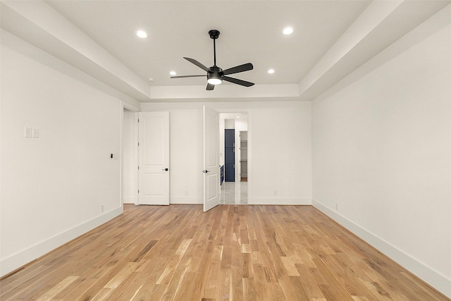 1038 W 31st St, Houston, TX 77018 - unfurnished bedroom with light wood finished floors, baseboards, recessed lighting, and a ceiling fan