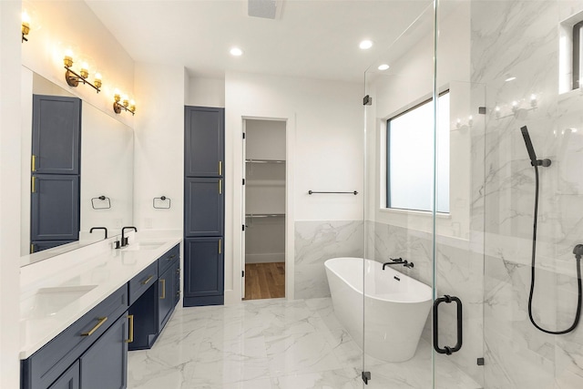 1038 W 31st St, Houston, TX 77018 - full bathroom with marble tiled flooring, a marble finish shower, a freestanding bath, double vanity, and a spacious closet