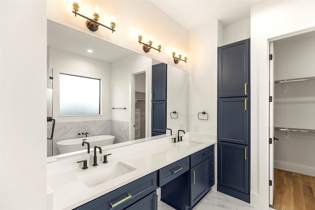 1038 W 31st St, Houston, TX 77018 - bathroom featuring a spacious closet, a freestanding tub, double vanity, and recessed lighting