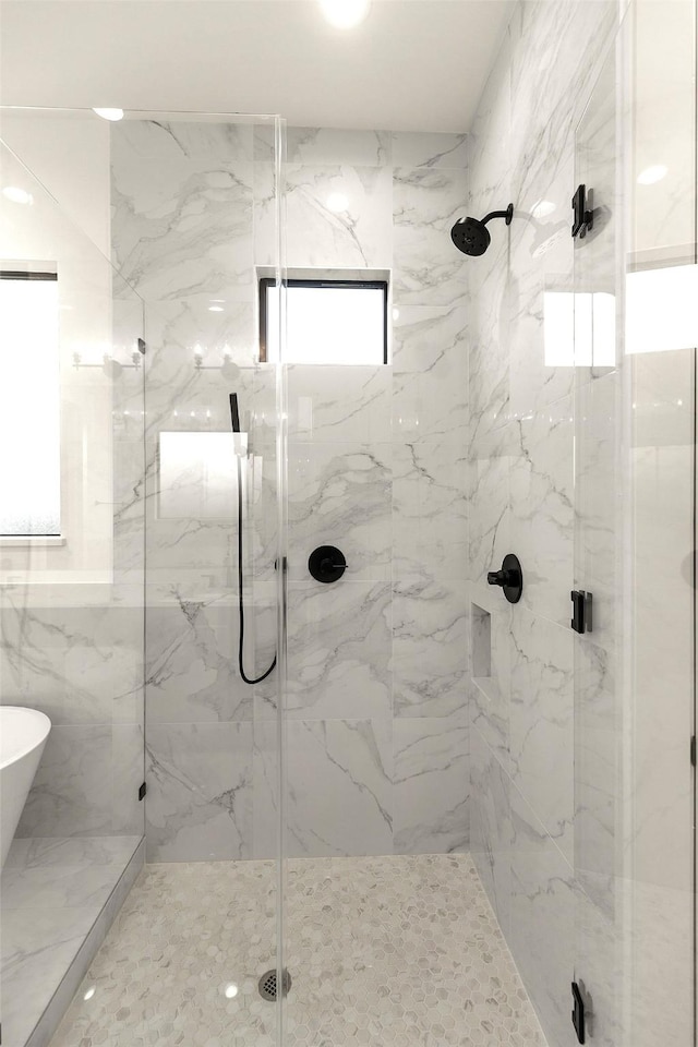 1038 W 31st St, Houston, TX 77018 - bathroom featuring a marble finish shower and a soaking tub