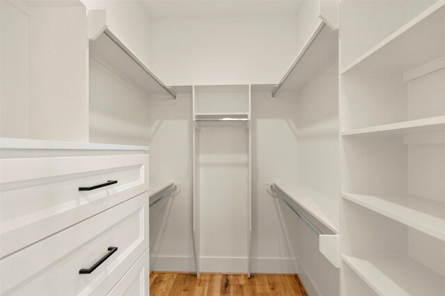 1038 W 31st St, Houston, TX 77018 - walk in closet with light wood-type flooring
