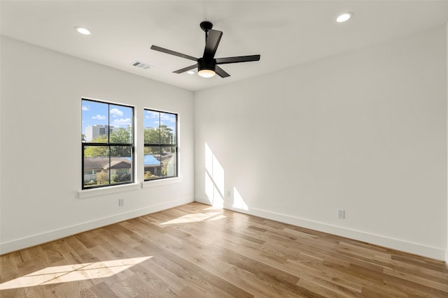 1038 W 31st St, Houston, TX 77018 - spare room featuring ceiling fan, baseboards, light wood-style floors, and recessed lighting