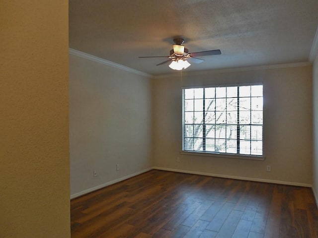 spare room with a ceiling fan, wood-type flooring, baseboards, and crown molding