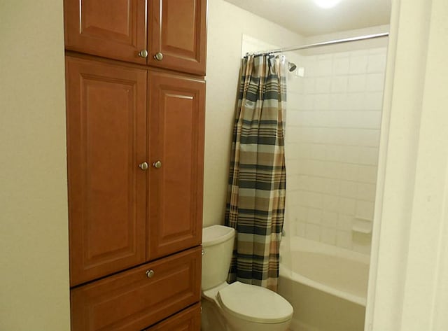bathroom with toilet and shower / bath combo