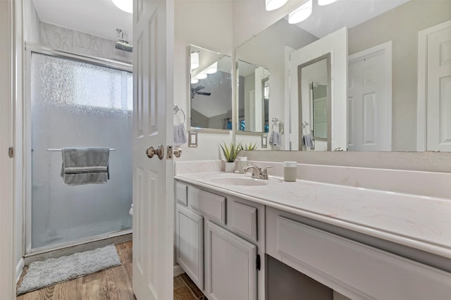 710 Razee Ct, Crosby, TX 77532 - full bathroom featuring a shower stall, vanity, and wood finished floors
