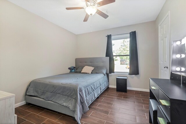 710 Razee Ct, Crosby, TX 77532 - bedroom with baseboards, wood finish floors, and a ceiling fan