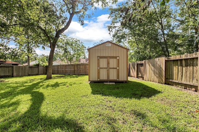 710 Razee Ct, Crosby, TX 77532 - view of yard featuring a storage unit and an outbuilding