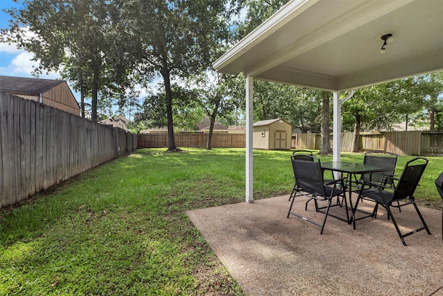 710 Razee Ct, Crosby, TX 77532 - view of yard with a storage unit, a patio area, an outbuilding, and outdoor dining area