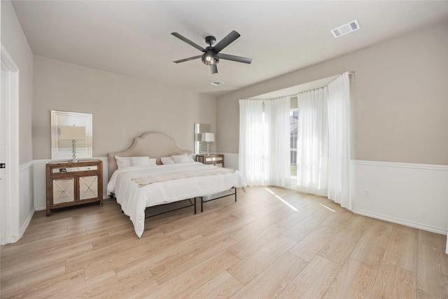 30427 Legacy Pines Dr, Spring, TX 77386 - bedroom with light wood-style flooring, a ceiling fan, and baseboards