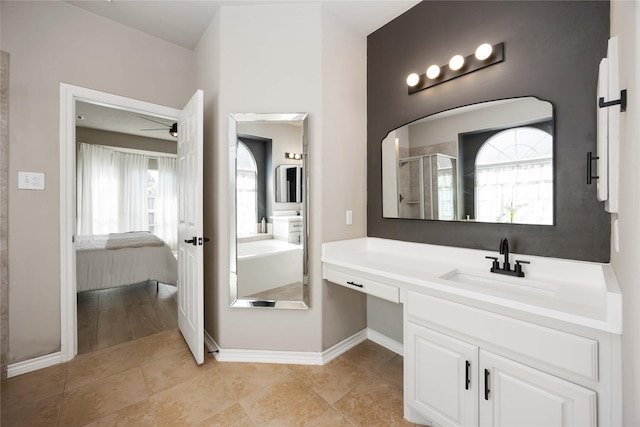 30427 Legacy Pines Dr, Spring, TX 77386 - bathroom featuring a stall shower, plenty of natural light, baseboards, and ensuite bathroom