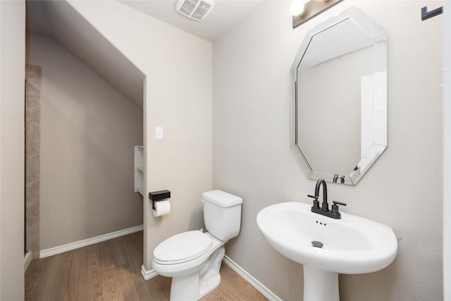 30427 Legacy Pines Dr, Spring, TX 77386 - half bath with a sink, wood finished floors, toilet, and baseboards