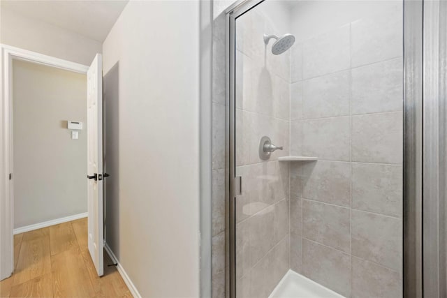 30427 Legacy Pines Dr, Spring, TX 77386 - full bathroom with a shower stall, wood finished floors, and baseboards