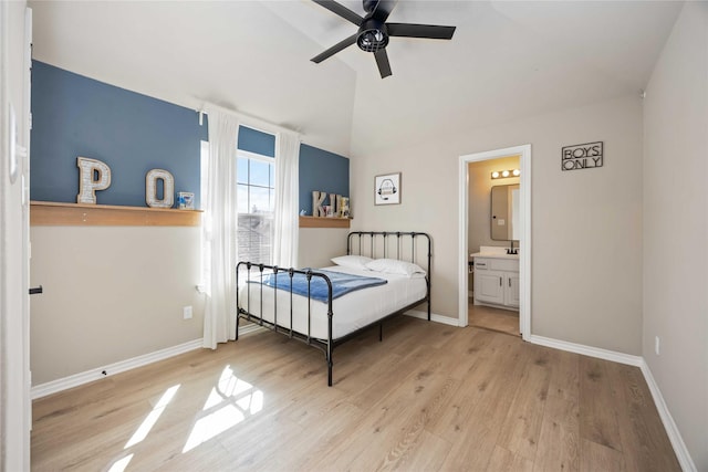 30427 Legacy Pines Dr, Spring, TX 77386 - bedroom featuring light wood-style flooring, baseboards, lofted ceiling, and ensuite bath