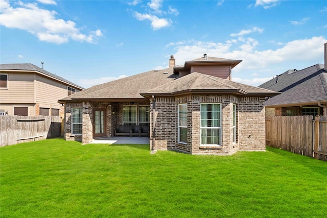 30427 Legacy Pines Dr, Spring, TX 77386 - back of property with brick siding, a patio area, a chimney, and roof with shingles