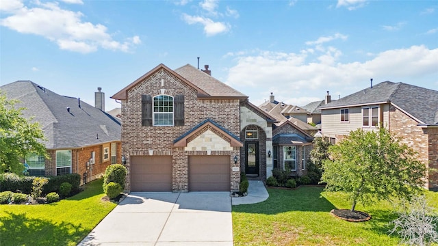 30427 Legacy Pines Dr, Spring, TX 77386 - french country inspired facade with a garage, brick siding, driveway, and a front yard