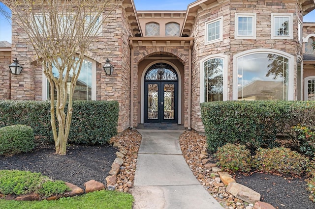 6623 Green Gable Mnr, Spring, TX 77389 - entrance to property featuring french doors and stone siding