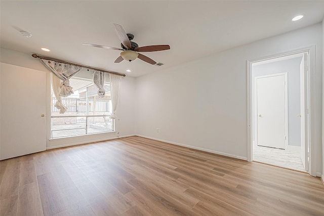 5723 Jason St, Houston, TX 77096 - spare room featuring light wood-style flooring, a ceiling fan, baseboards, and recessed lighting