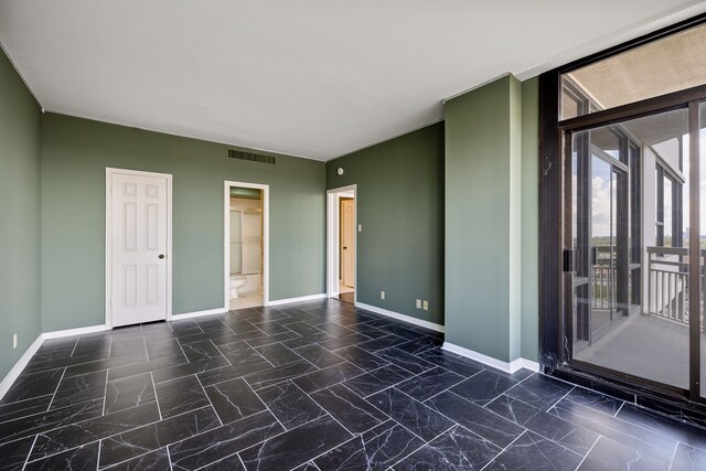 15 Greenway Plz Unit 11A, Houston, TX 77046 - empty room with baseboards and dark marble finish flooring