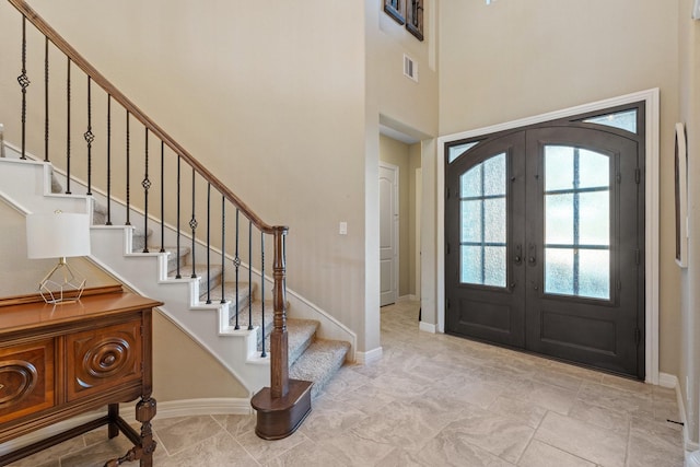 5131 Rowley Falls Ln, Sugar Land, TX 77479 - foyer featuring healthy amount of natural light, french doors, stairway, and a high ceiling