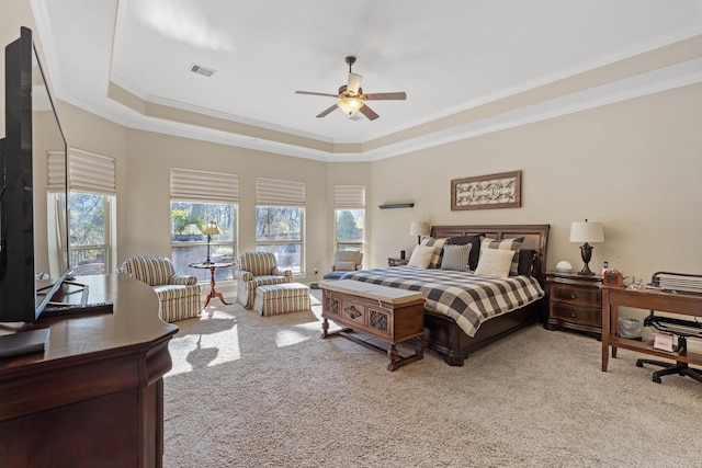 5131 Rowley Falls Ln, Sugar Land, TX 77479 - carpeted bedroom featuring a tray ceiling, ornamental molding, ceiling fan, and a desk