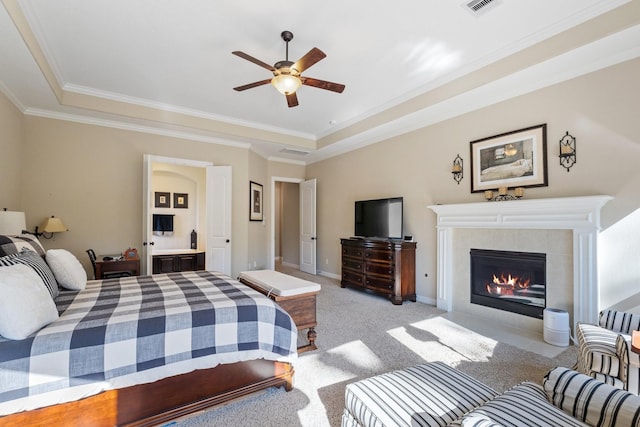 5131 Rowley Falls Ln, Sugar Land, TX 77479 - bedroom featuring crown molding, light colored carpet, a tiled fireplace, a tray ceiling, and baseboards