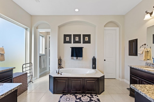 5131 Rowley Falls Ln, Sugar Land, TX 77479 - full bathroom featuring tile patterned flooring, a garden tub, baseboards, vanity, and recessed lighting