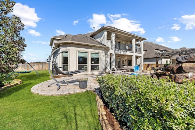 5131 Rowley Falls Ln, Sugar Land, TX 77479 - rear view of house featuring a balcony, ceiling fan, a patio, and stucco siding