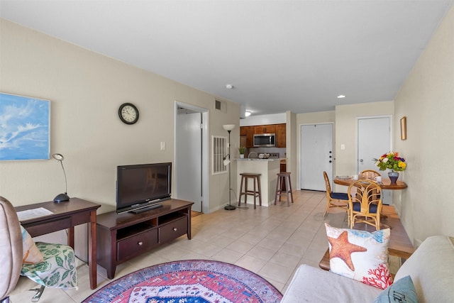 13151 Walden Rd Unit 135, Montgomery, TX 77356 - living area with light tile patterned flooring and baseboards